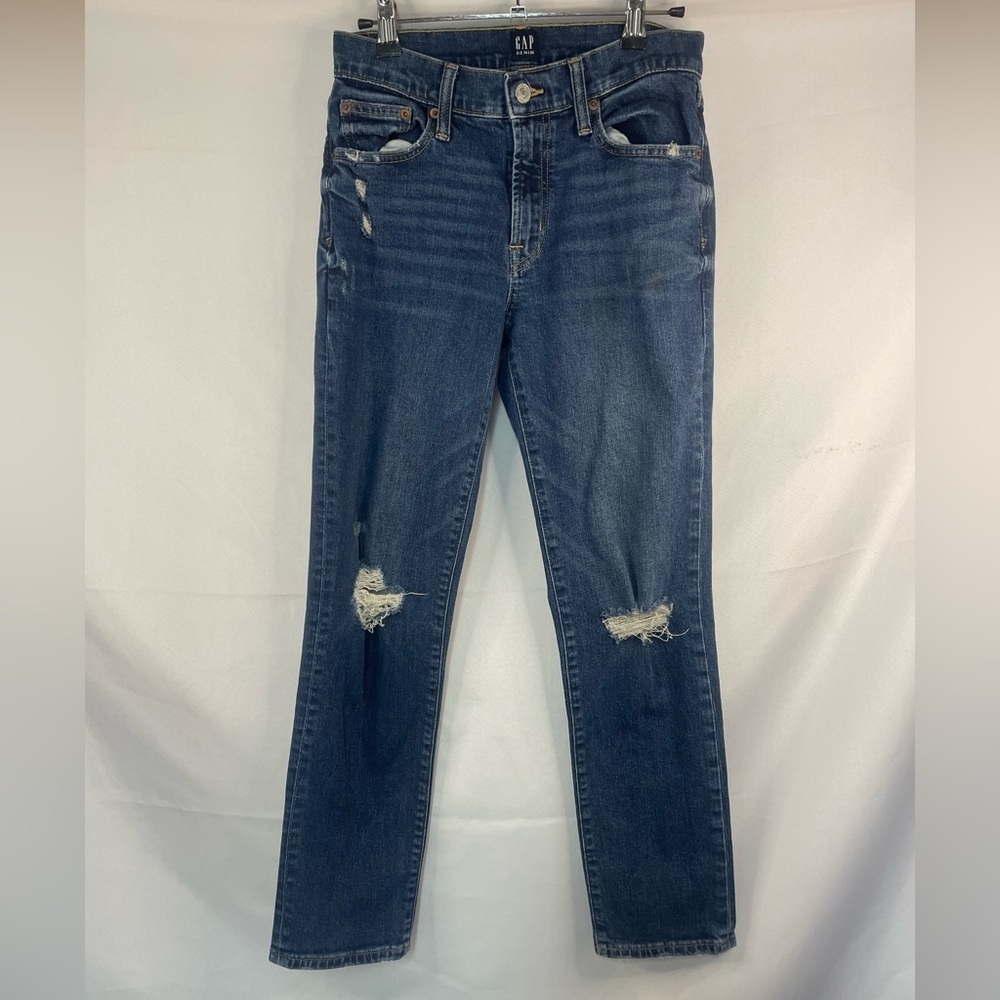 Gap girlfriend fit jeans, medium wash either distressed holes. Size 00